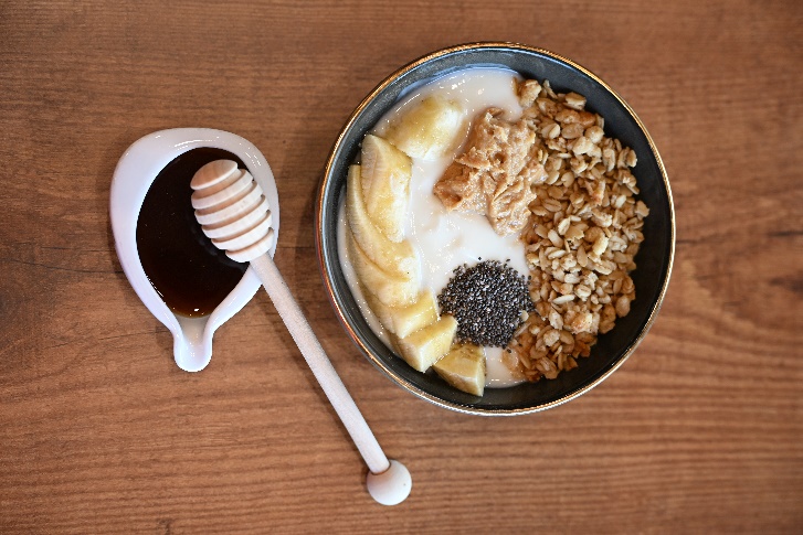 Granola and yogurt bowl with honey